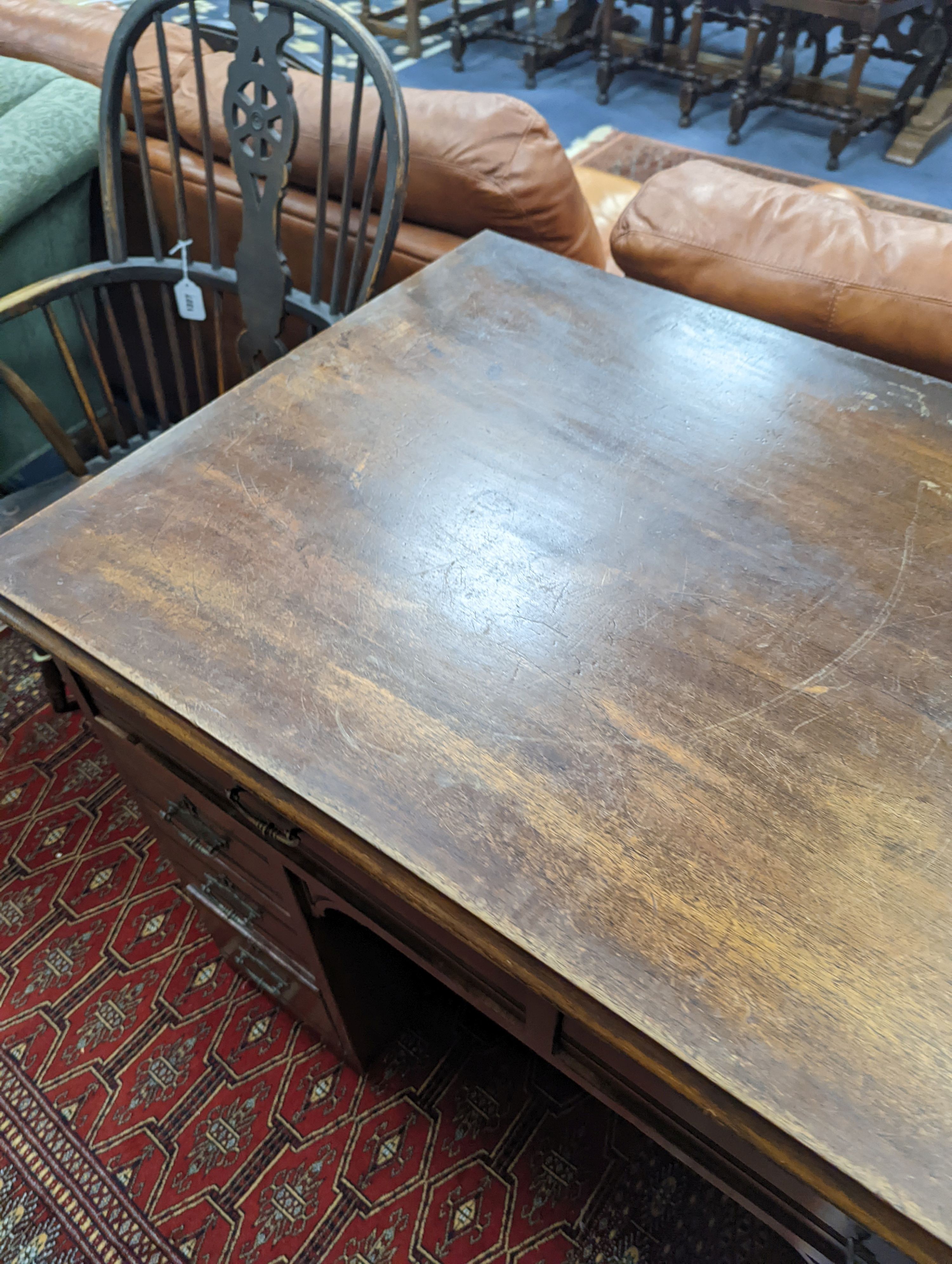 A late Victorian mahogany kneehole desk, length 107cm, height 80cm